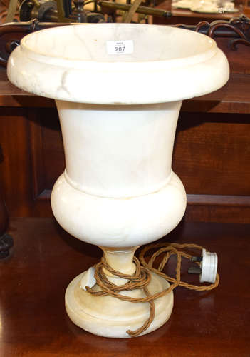 Pair of marble effect.urns of campana form (converted to table lamps), rim chips and one repaired,