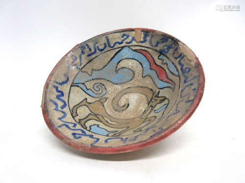 Flared pottery Islamic bowl decorated with a horse and geometric design, 14cm diam