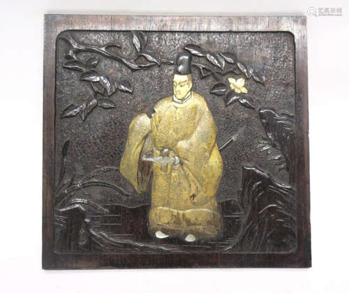 Chinese wooden panel with a relief design including a Chinese figure with face and feet picked out