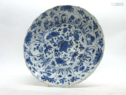 Chinese porcelain plate with a flowering design of plants in Kangxi style, with Kangxi motif to