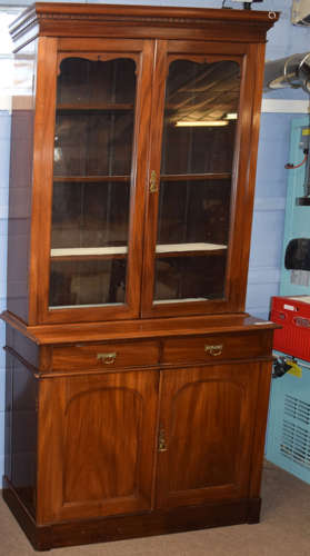 Late 19th century mahogany bookcase cabinet, the top with two plain glazed doors beneath a dentil