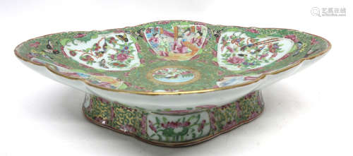 Large 19th century Cantonese dish of lobed shape decorated in typical fashion with panels of Chinese