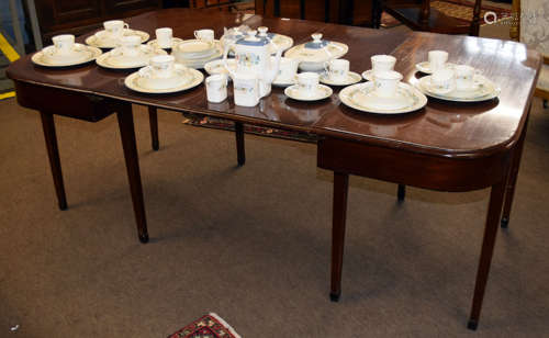 19th century mahogany D-end dining table, the two ends joined by two central leaves with brass clips