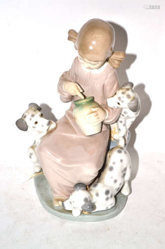 Lladro figure of a young girl with three puppies