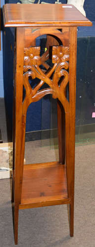 Pair of Art Nouveau style mahogany plant or bust stands, having square tops, foliate pierced and