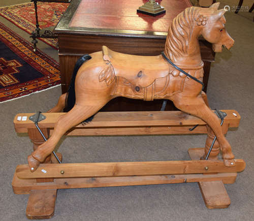 Good quality carved pine rocking horse with stretcher base, width 133cm x 57cm deep x 110cm high (