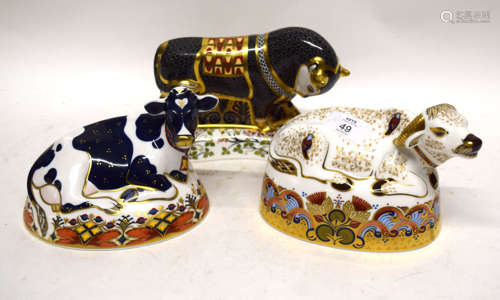 Group of three Royal Crown Derby paperweights with gold tops, including Friesian cow, Water