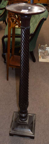 19th century dark mahogany torchere with circular top to a wrythen turned column and sloped square