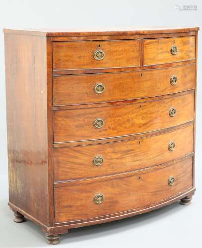 AN EARLY 19TH CENTURY MAHOGANY BOW FRONTED CHEST O