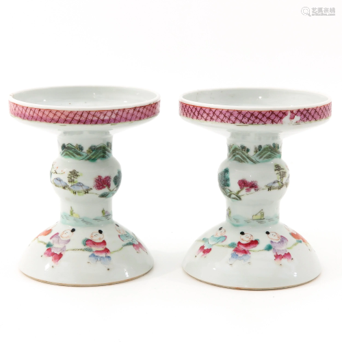 A Pair of Famille Rose Candlesticks