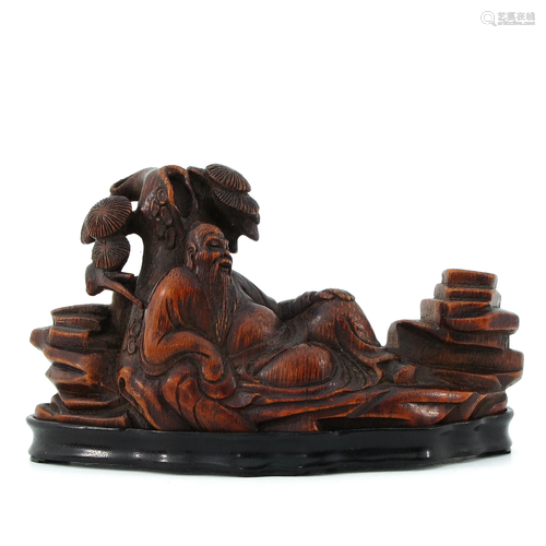 A Carved Wood Sculpture on Base