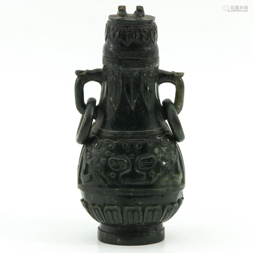 A Carved Jade Hu Vase and Cover