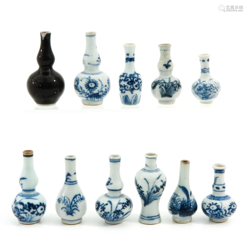 A Collection of 11 Miniature Vases