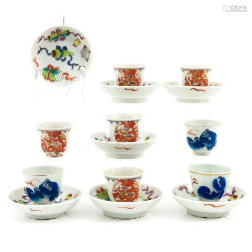 A Collection of Miniature Cups and Saucers