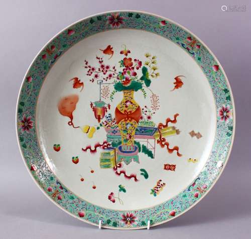 A CHINESE FAMILLE ROSE PORCELAIN CHARGER, With decoration depicting displays of native flora, with