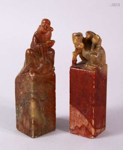 A PAIR OF 19TH / 20TH CENTURY CHINESE CARVED SOAPSTONE SEALS, one of monkeys upon horse, the other