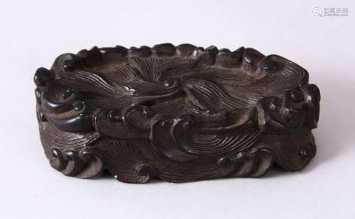 A CHINESE MOULDED WAVE STAND, in the form of crashing waves, 12cm wide x 5.5cm.