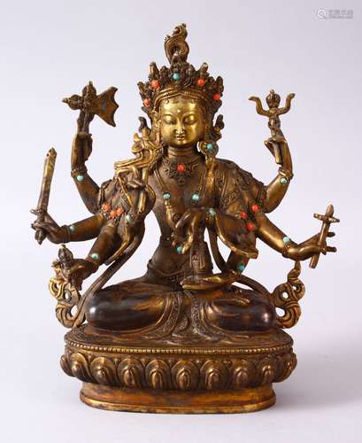 A GOOD TIBETAN GILT BRONZE FIGURE OF A MULTI ARMED DIETY, inlaid with semi precious stones, 22.5cm