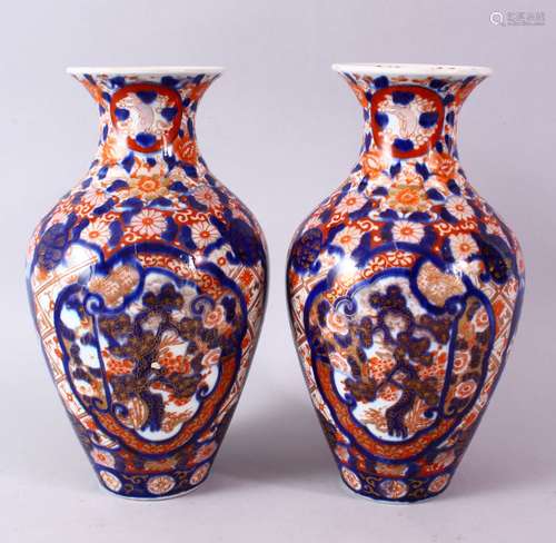 A PAIR OF MEIJI PERIOD IMARI VASES, 26cm high.