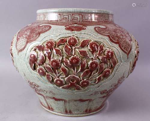 A LARGE CHINESE MING STYLE COPPER RED CARVED PORCELAIN VASE, with carved flroal panels and border