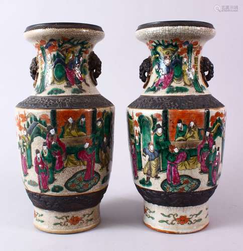 A PAIR OF 19TH CENTURY CHINESE FAMILLE VERTE / ROSE PORCELAIN CARNIVAL VASES, decorated with many