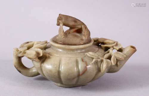 A CHINESE CARVED SOAPSTONE PHOENIX TEAPOT, carved with relief flora around the ribbed body, with a