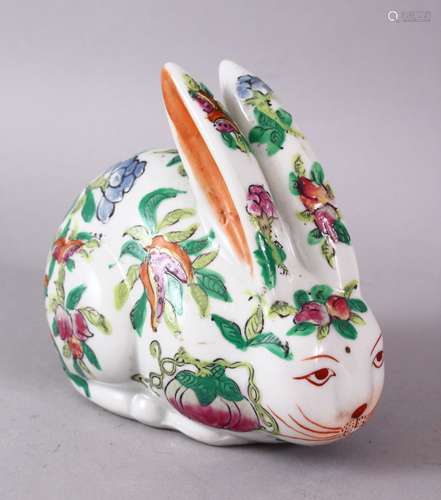 A 20TH CENTURY FAMILLE ROSE PORCELAIN HARE, painted with peach tree decoration, 12cm long.