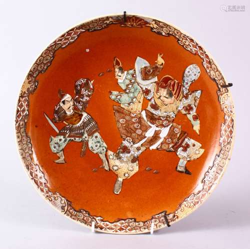 A JAPANESE MEIJI PERIOD SATSUMA DISH, decorated with three warriors in raised enamel, 31.5cm