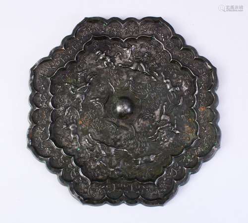 A LARGE 18TH CENTURY CHINESE CAST BRONZE MIRROR, the decoration depicting a hunting scene, 24cm