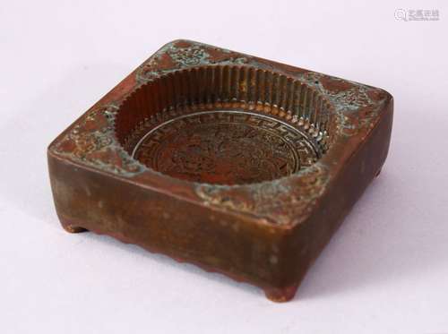 A CHINESE BRONZE CARVED MOULD, with bat decoration and interior depicting a landscape, seal mark