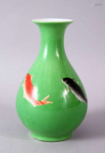 A CHINESE GREEN GLAZED VASE, painted with fish, mark in red, 15cm high.