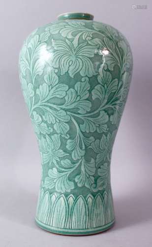 A LARGE KOREAN CELEDON VASE, the body with srolling foliage, signed, 38cm high.