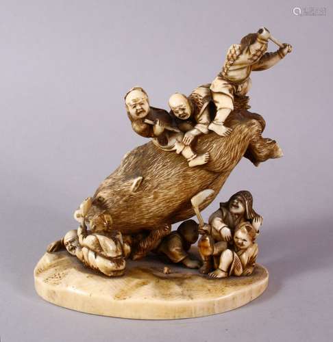 A JAPANESE MEIJI PERIOD CARVED IVORY OKIMONO GROUP- depicting a boar being attacked by numerous