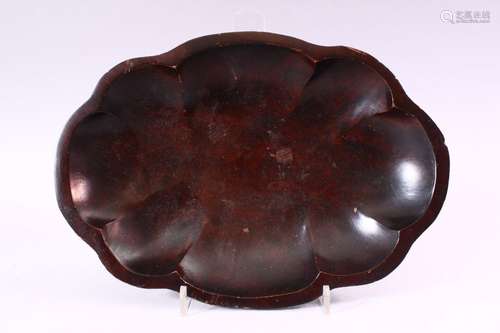 A CARVED WOOD BOWL OF LOBED OVAL FORM, 29cm x 20cm.