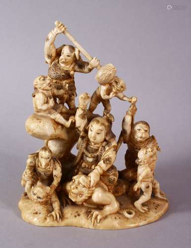 A JAPANESE MEIJI PERIOD CARVED IVORY OKIMONO GROUP - depicting figures attacking oni demons, one dog