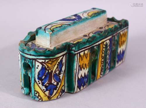 A PERSIAN PAINTED POTTERY INKSTAND AND COVER, the interior with six pen holders and an inkwell, 16cm