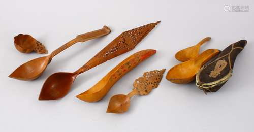 A COLLECTION OF 19TH CENTURY PERSIAN CARVED WOODEN SPOONS, various sizes and carvings, (7)