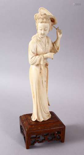 A JAPANESE MEIJI PERIOD CARVED IVORY OKIMONO OF A GEISHA GIRL & FAN, stood holding an uchiwa fan