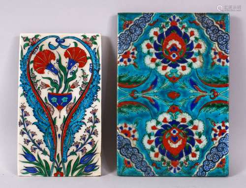 TWO GOOD IZNIK POTTERY TILES, one with white ground and decorated with formal floral motif, 21cm x