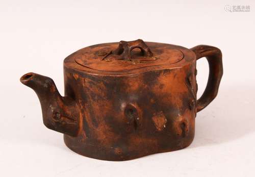 A CHINESE YIXING TEAPOT, of naturalistic form, 20cm wide.