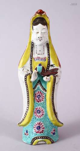 A 19TH CENTURY FAMILLE ROSE PORCELAIN FIGURE OF GUANYIN, with floral decoration, 23.5cm high.