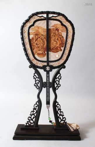 A VERY GOOD CHINESE EBONY, SANDLEWOOD AND IVORY DOUBLE SIDED FAN & STAND, the fan with pierced,