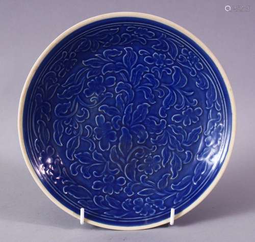 A CHINESE SONG STYLE BLUE GROUND CARVED FLORAL PORCELAIN DISH, 20.5cm