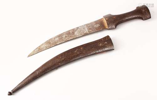 AN EARLY QAJAR STEEL DAGGER, the sheath carved with scrolling foliage, the blade with traces of