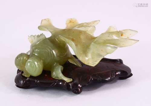 A CHINESE CARVED JADE FIGURE OF A GOLDFISH, on a carved wooden base, 10cm.