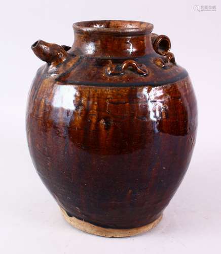 A CHINESE TREACE GLAZED POTTERY EWER, possibly Song dynasty, with moulded handle and spout, 26cm.