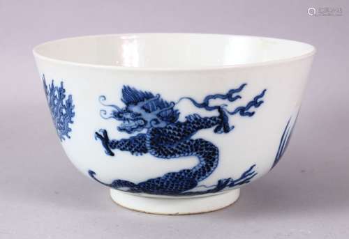 A CHINESE BLUE AND WHITE PORCELAIN BOWL, painted with phoenix and dragons, the base with Kangxi