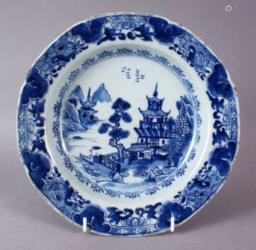 A 19TH CENTURY CHINESE WILLOW PATTERN SOUP BOWL, (AF), 23cm diameter.