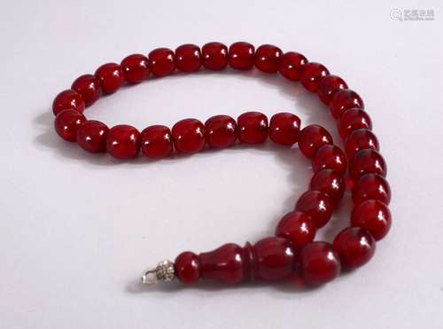 A CONTEMPORARY CHINESE CHERRY AMBER NECKLACE, approx. 40cm long.