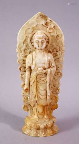 A 19TH / 20TH CENTURY CHINESE CARVED WHITE JADE / SOAPSTONE FIGURE OF A DEITY / BUDDHA, stood upon a